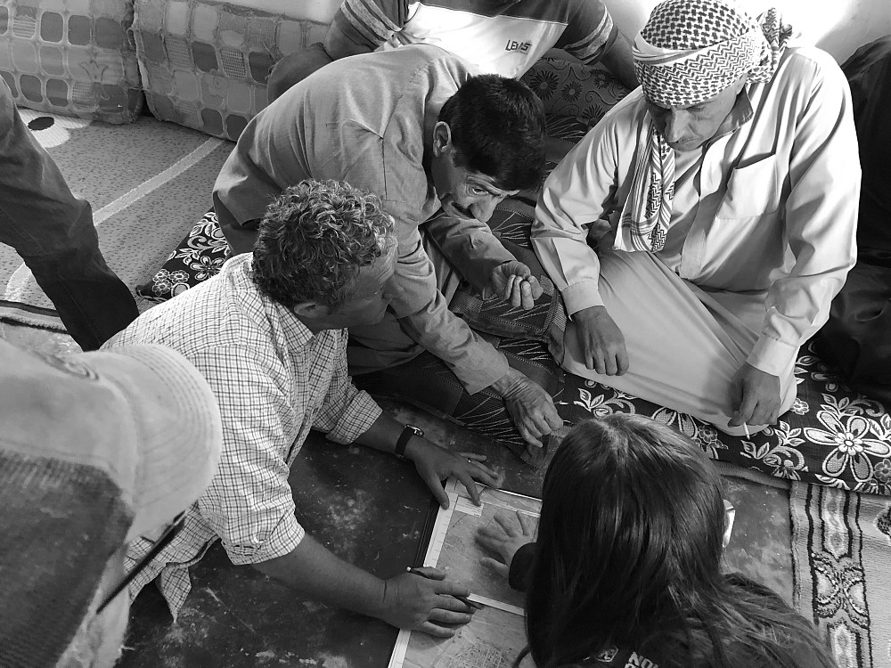 Project staff and members of the local community during the shura at the start of operations